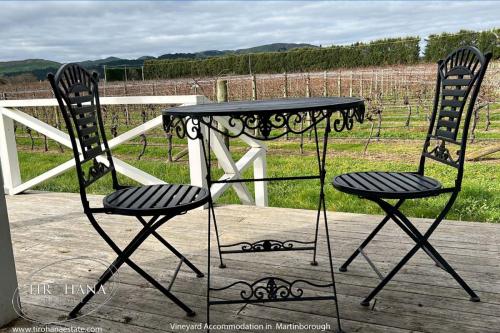 The Verandah wraps around the house on three sides, each with a view of the vines and Martinborough hills beyond